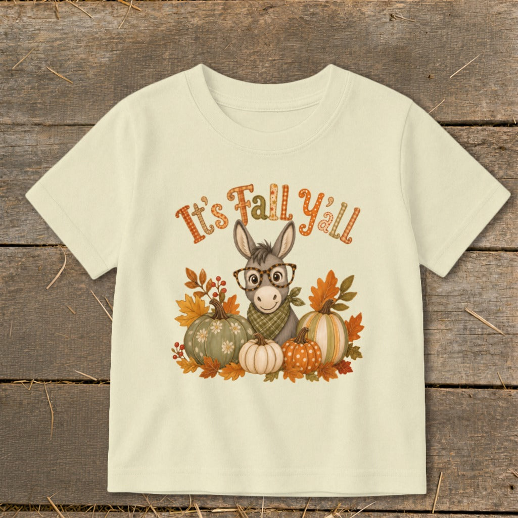 Light yellow t-shirt with cartoon donkey, pumpkins, and "It's Fall Y'all" text.