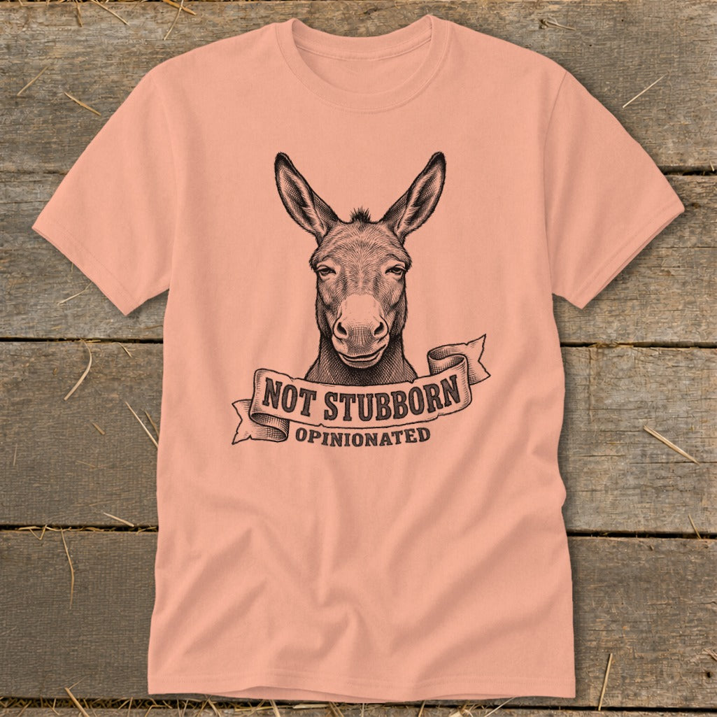 Peach t-shirt with a donkey graphic and text "NOT STUBBORN OPINIONATED".