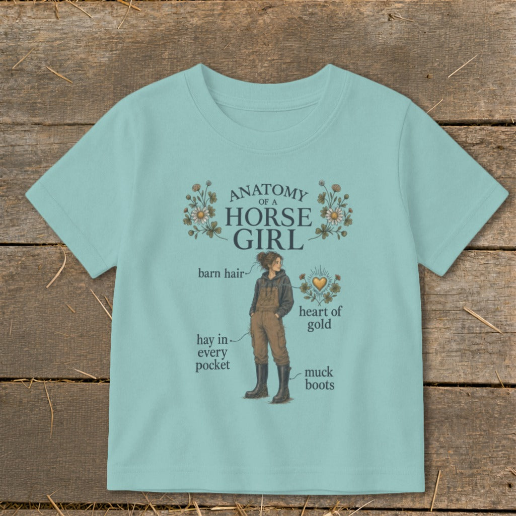 Turquoise t-shirt with "Anatomy of a Horse Girl" graphic and text labels.