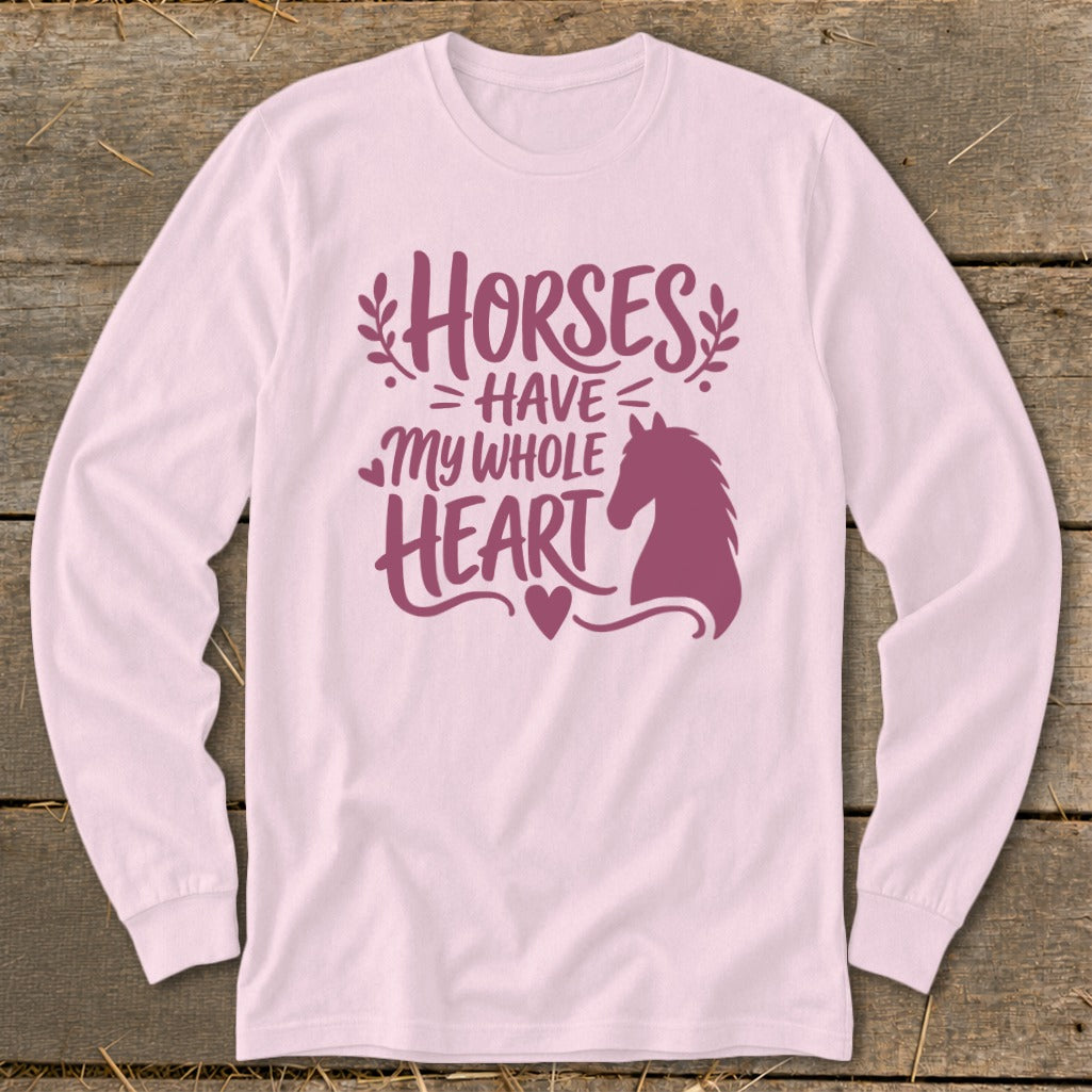 Long sleeve pink shirt with "Horses Have My Whole Heart" and horse silhouette design.