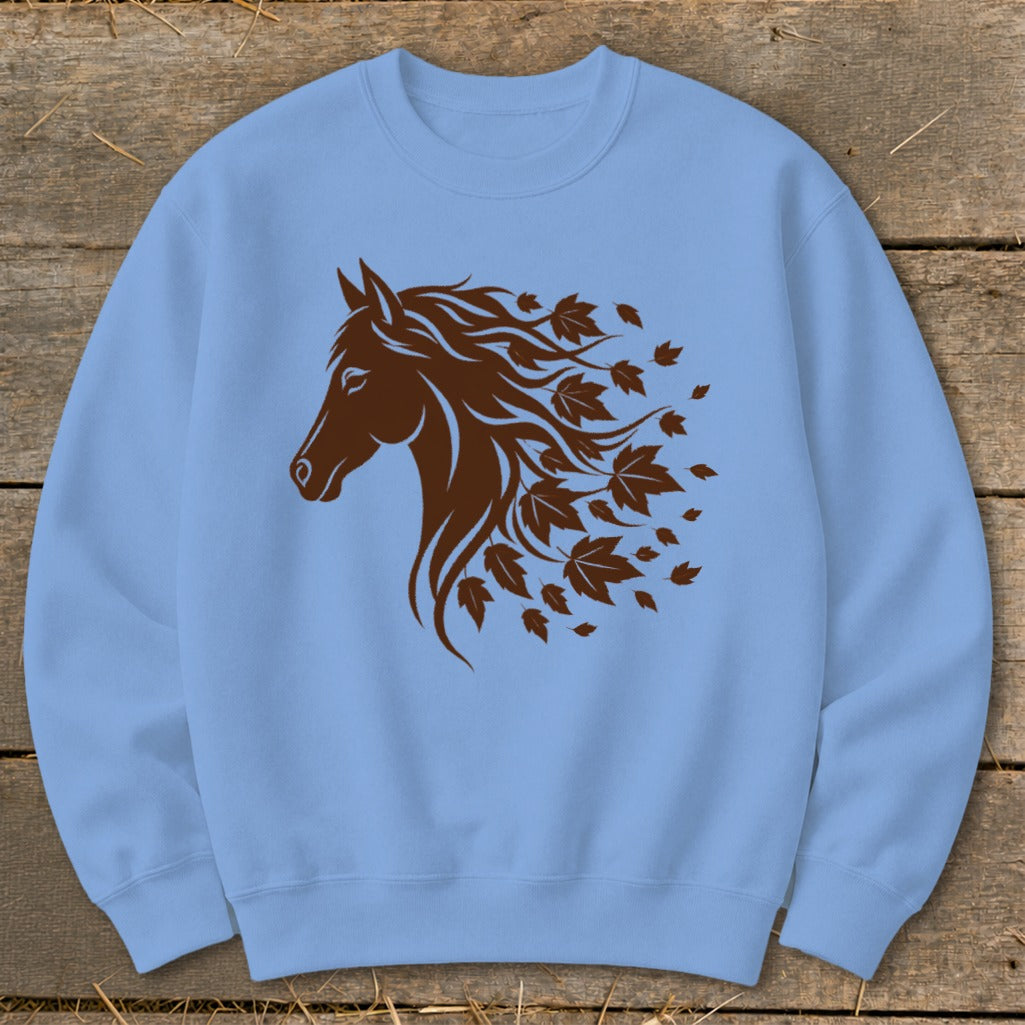 Light blue sweatshirt with a brown horse head and flowing mane made of leaves.