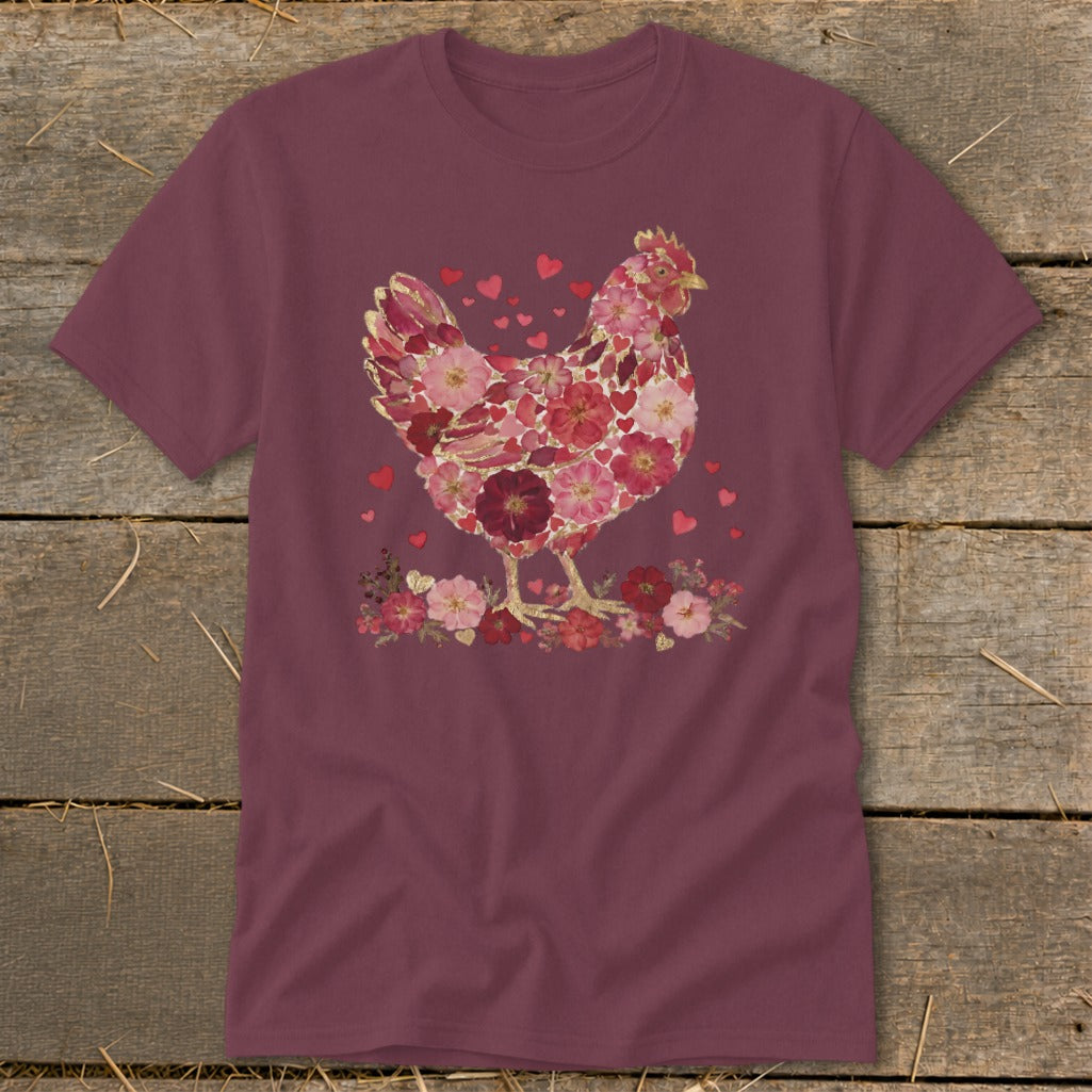 T-shirt with floral chicken design and scattered hearts.