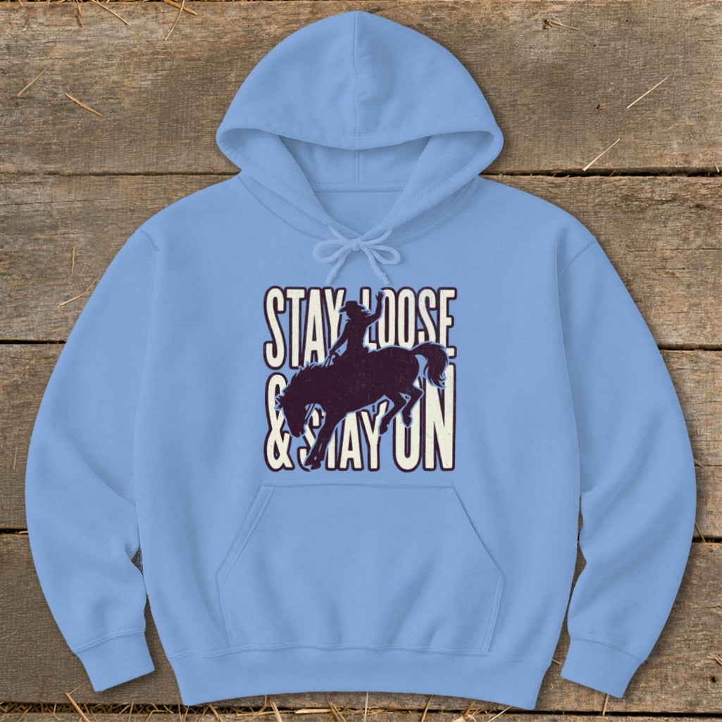 Light blue hoodie with "STAY LOOSE & STAY ON" text and bucking horse graphic.