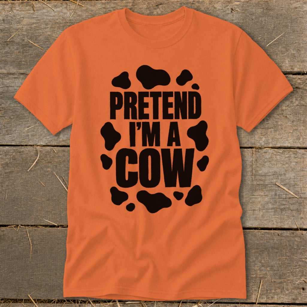 Orange t-shirt with black "Pretend I'm a Cow" text and cow spots.