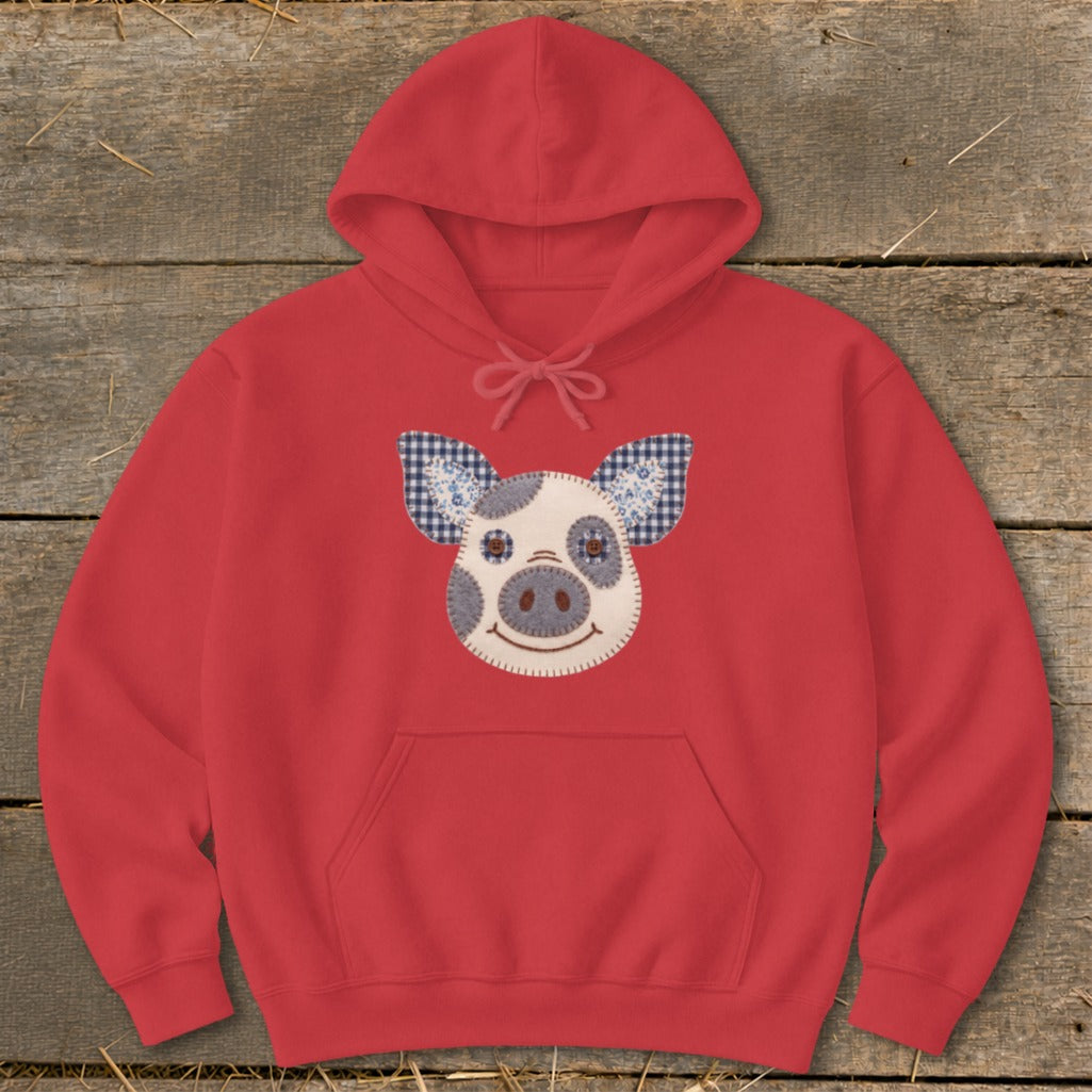Red hoodie with a stitched pig face applique on the front.