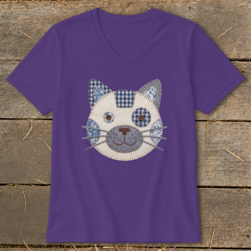 Purple v-neck t-shirt with a whimsical fabric cat face applique.