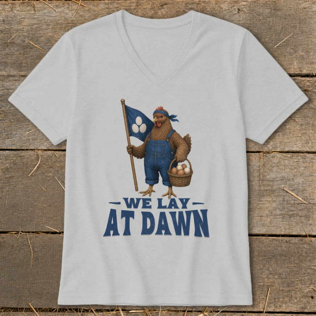 Chicken in overalls holding flag and basket of eggs, text reads "WE LAY AT DAWN".