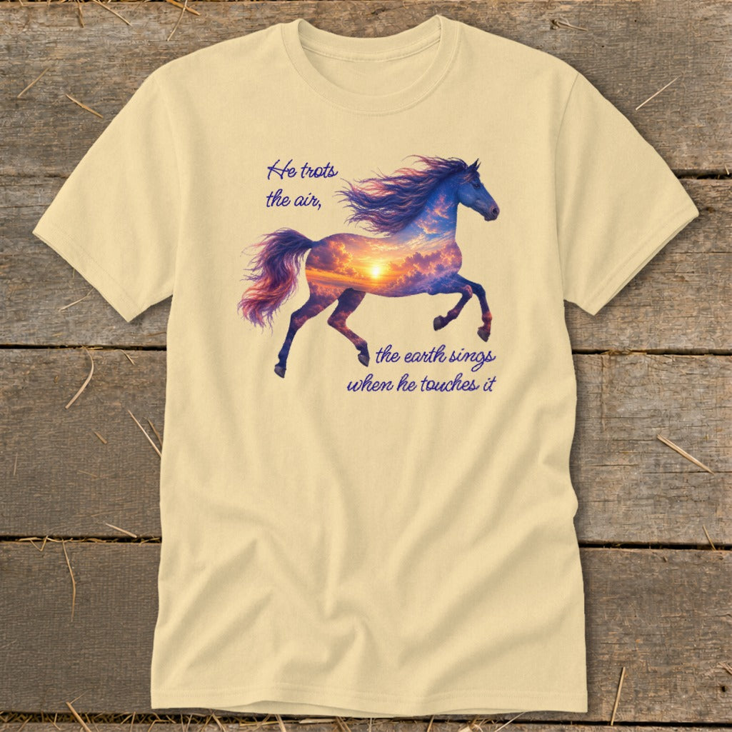 A cream t-shirt features a horse graphic containing a sunset sky and text reading He trots the air, the earth sings when he touches it.