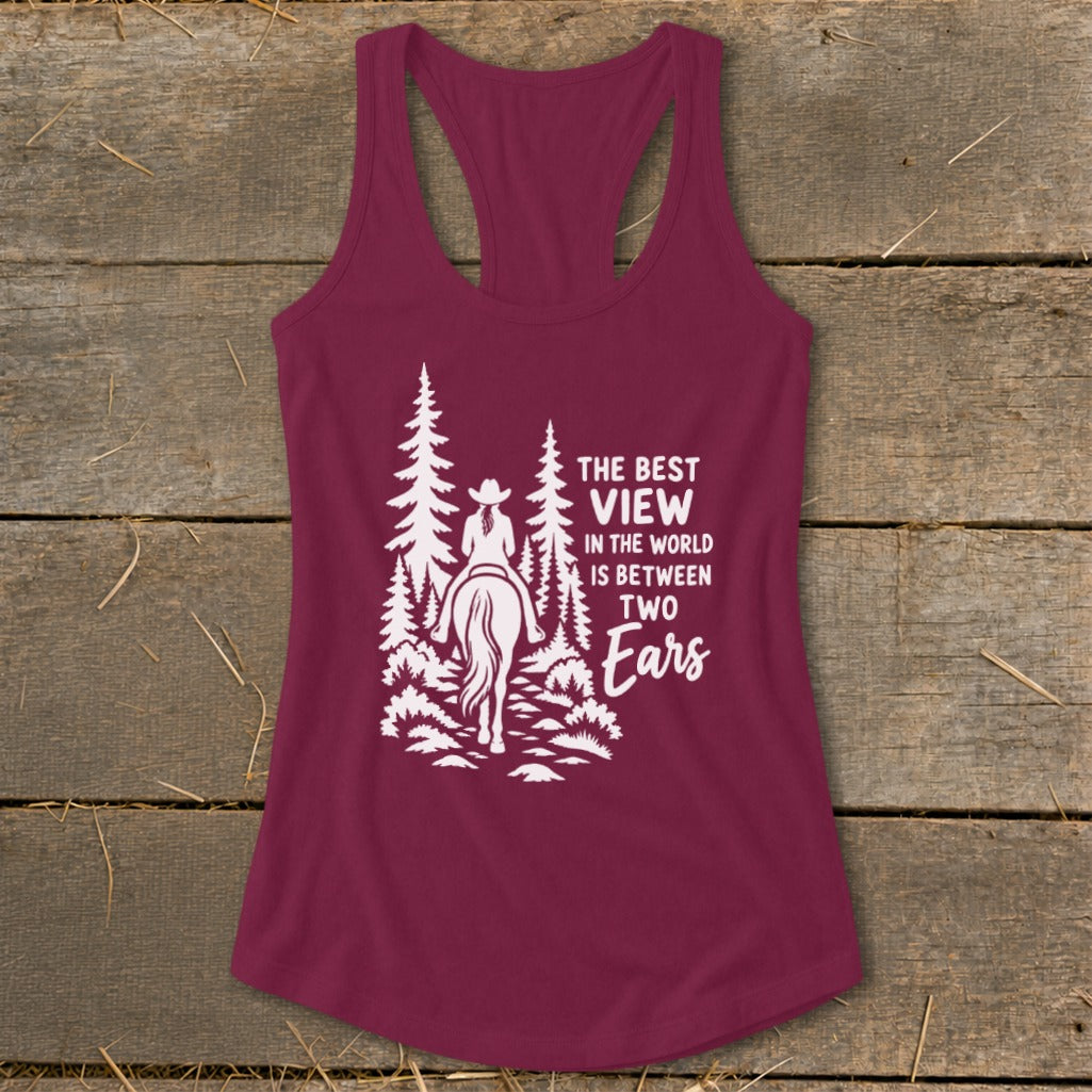 Maroon racerback tank top with white graphic of a horseback rider and pine trees.