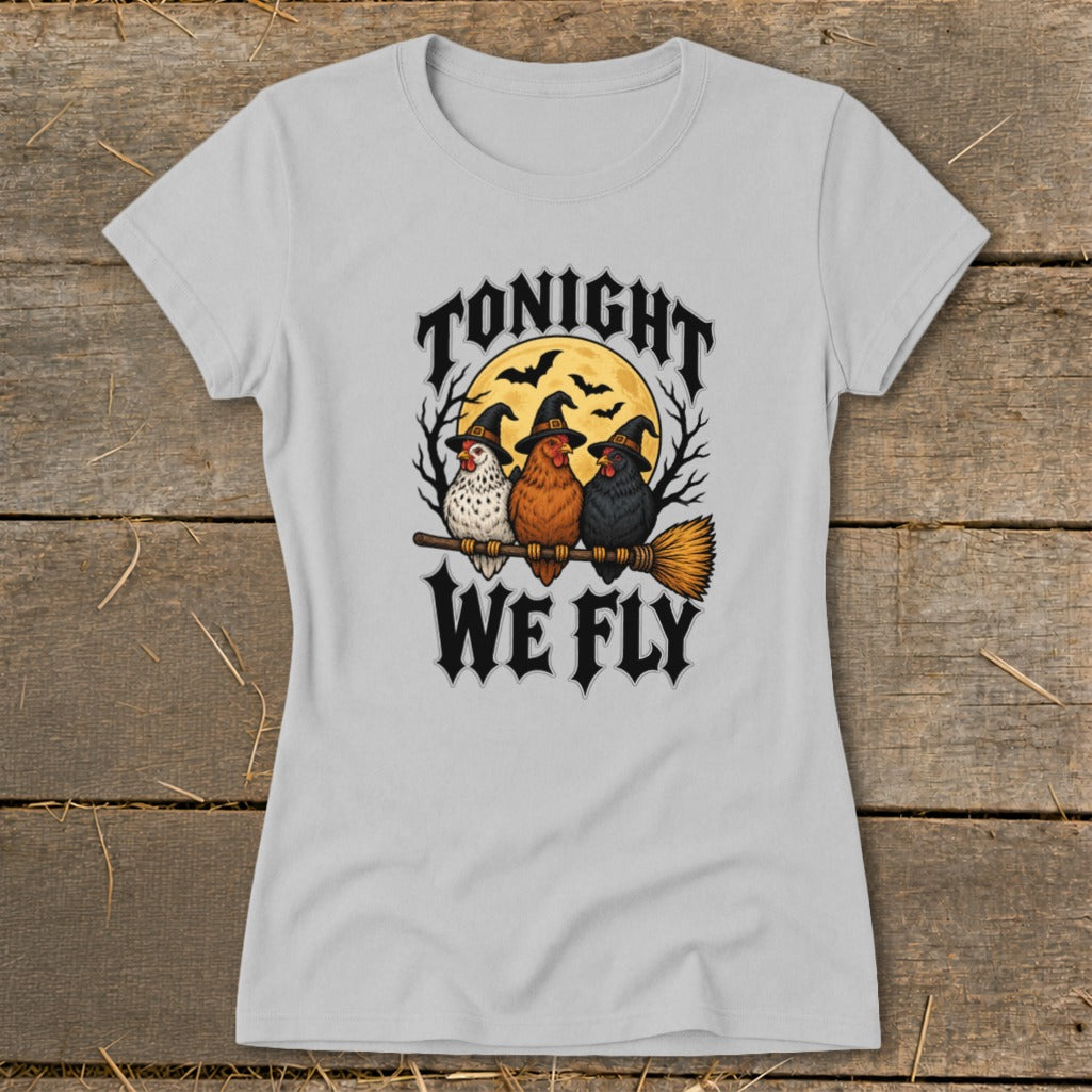 Three chickens wearing witch hats sit on a broomstick with the text "TONIGHT WE FLY".