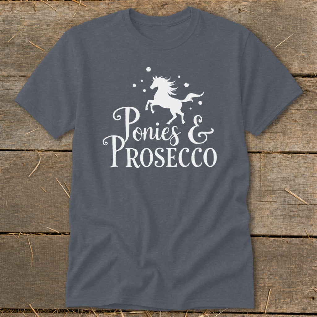 Dark grey t-shirt with white text and a running horse graphic that reads "Ponies & Prosecco".