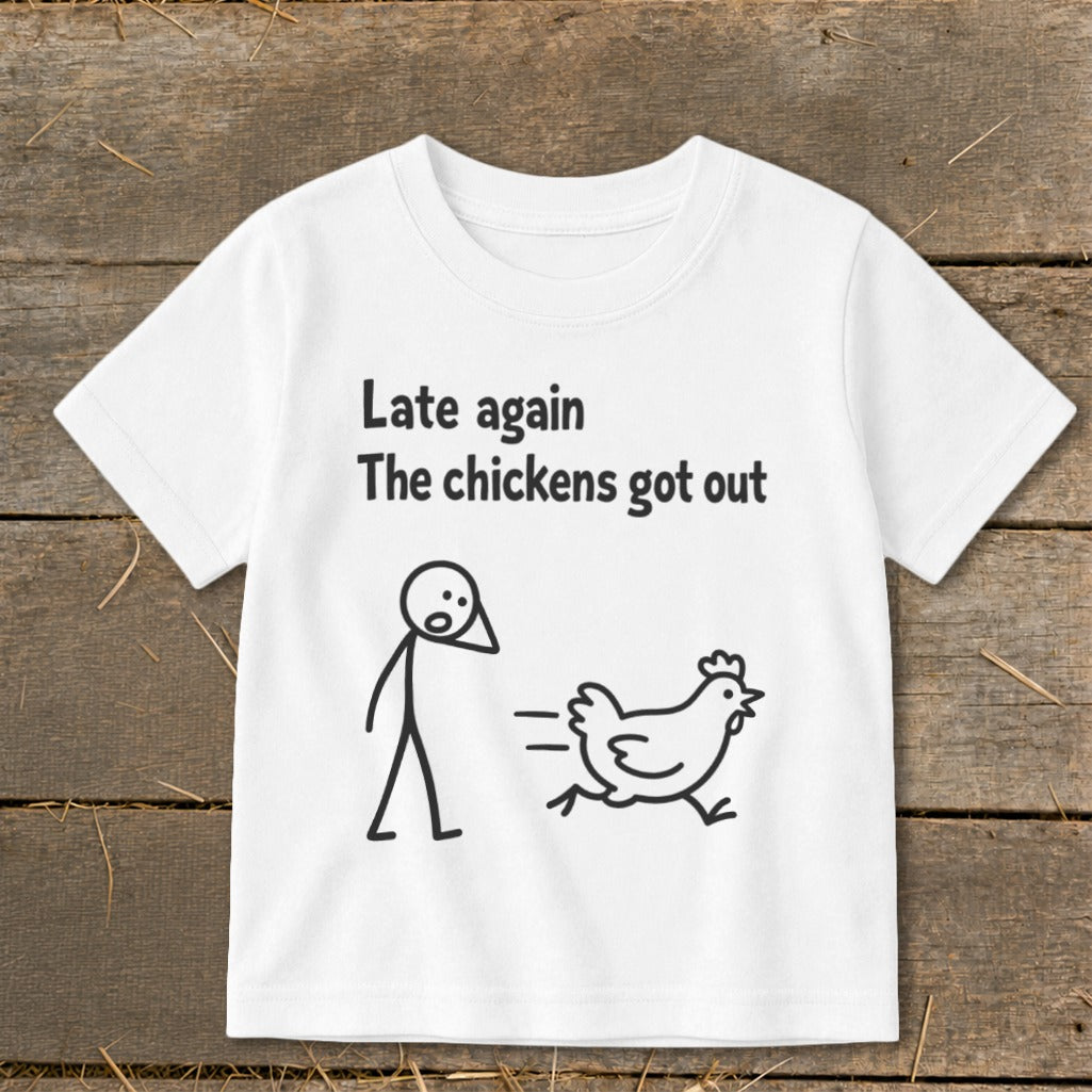 White t-shirt with text "Late again The chickens got out" and a cartoon chicken running.