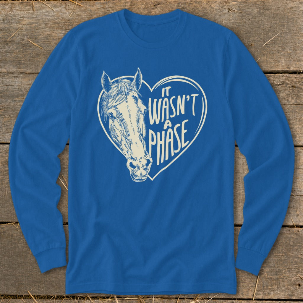 Blue long sleeve shirt with a horse head inside a heart saying "It Wasn't A Phase".