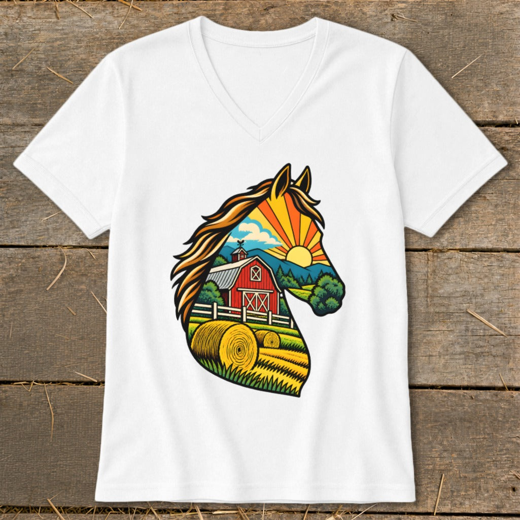 A white V-neck t-shirt featuring a graphic of a horse head silhouette filled with a farm scene containing a red barn, hay bales, and a sunrise.