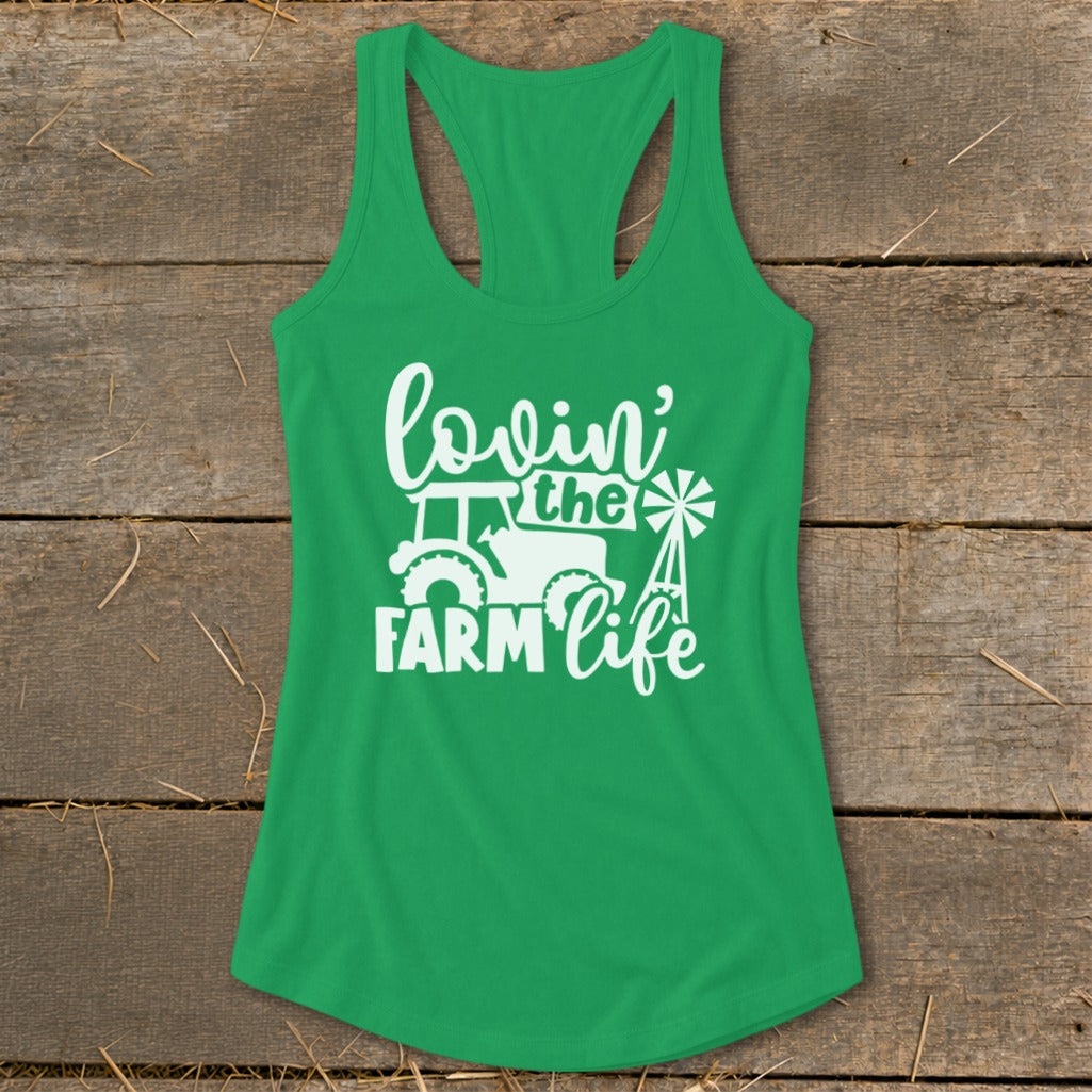 Green tank top with white "lovin' the farm life" graphic and tractor image.