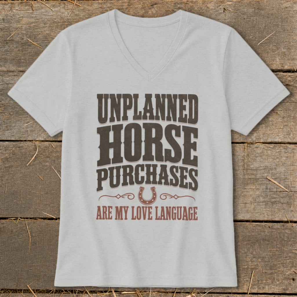 Grey v-neck t-shirt with "UNPLANNED HORSE PURCHASES ARE MY LOVE LANGUAGE" text and horseshoe graphic.