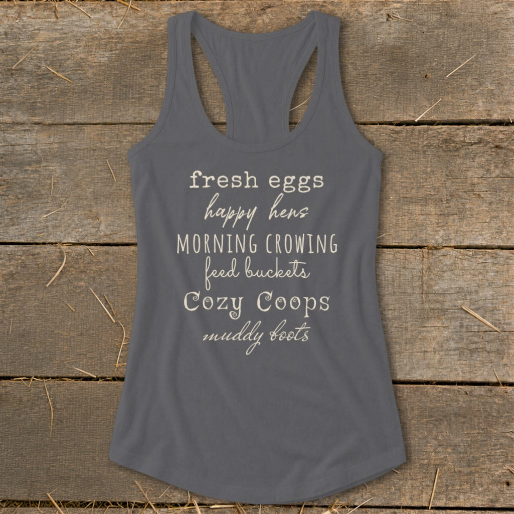 Gray tank top with text "fresh eggs happy hens MORNING CROWING feed buckets Cozy Coops muddy boots".