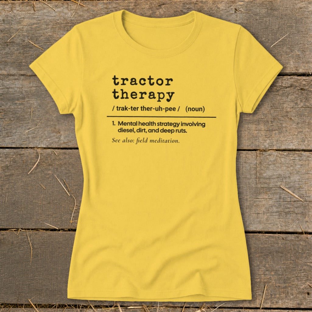 Yellow t-shirt with black text defining "tractor therapy" and "field meditation."