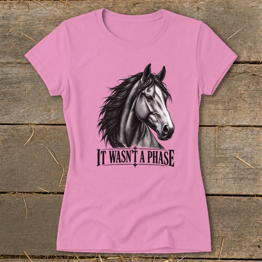 Pink t-shirt with a charcoal drawing of a horse's head and the text "IT WASN'T A PHASE".