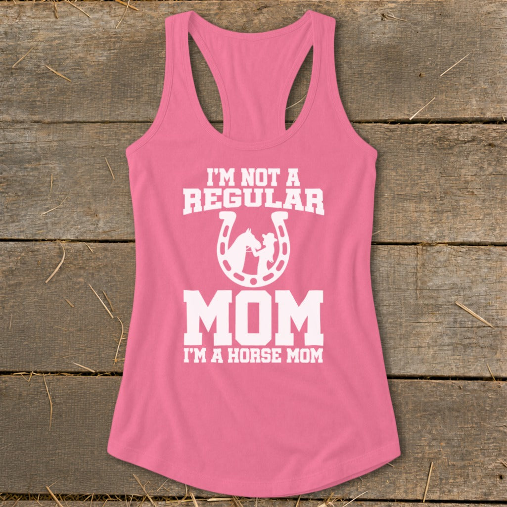 Pink tank top with white text reading "I'M NOT A REGULAR MOM I'M A HORSE MOM".