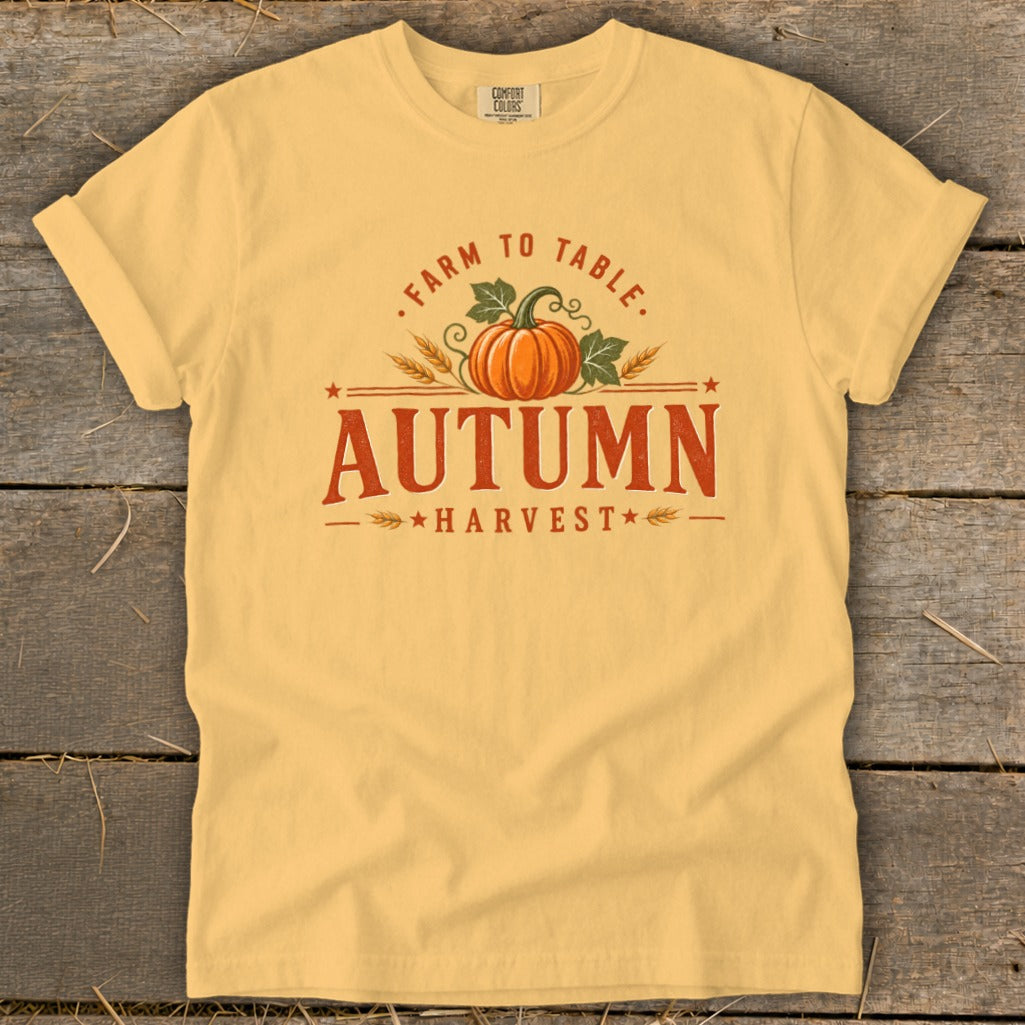 Yellow t-shirt with "Farm to Table Autumn Harvest" text and pumpkin graphic.