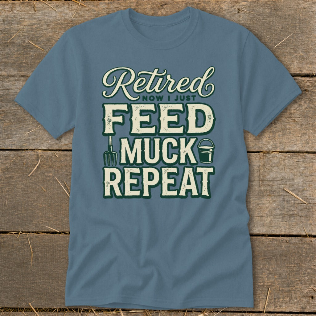 Blue t-shirt with "Retired, Now I Just Feed, Muck, Repeat" text and farm graphics.