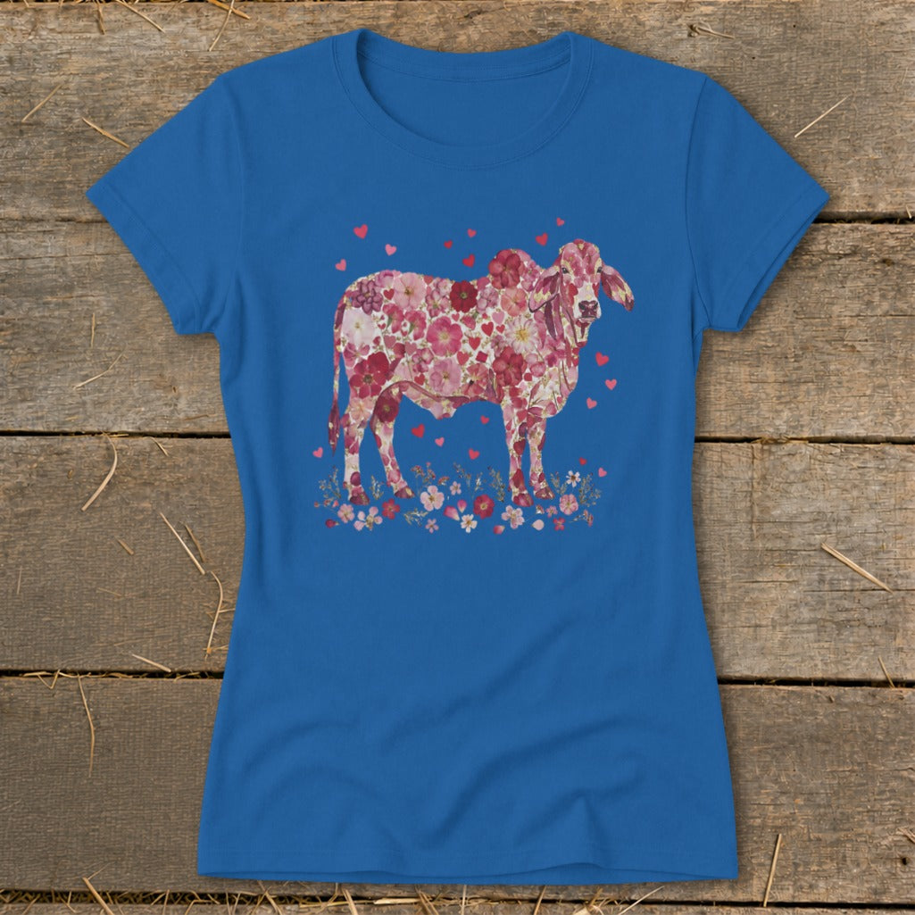 Blue t-shirt with a cow graphic made of pink flowers and hearts.