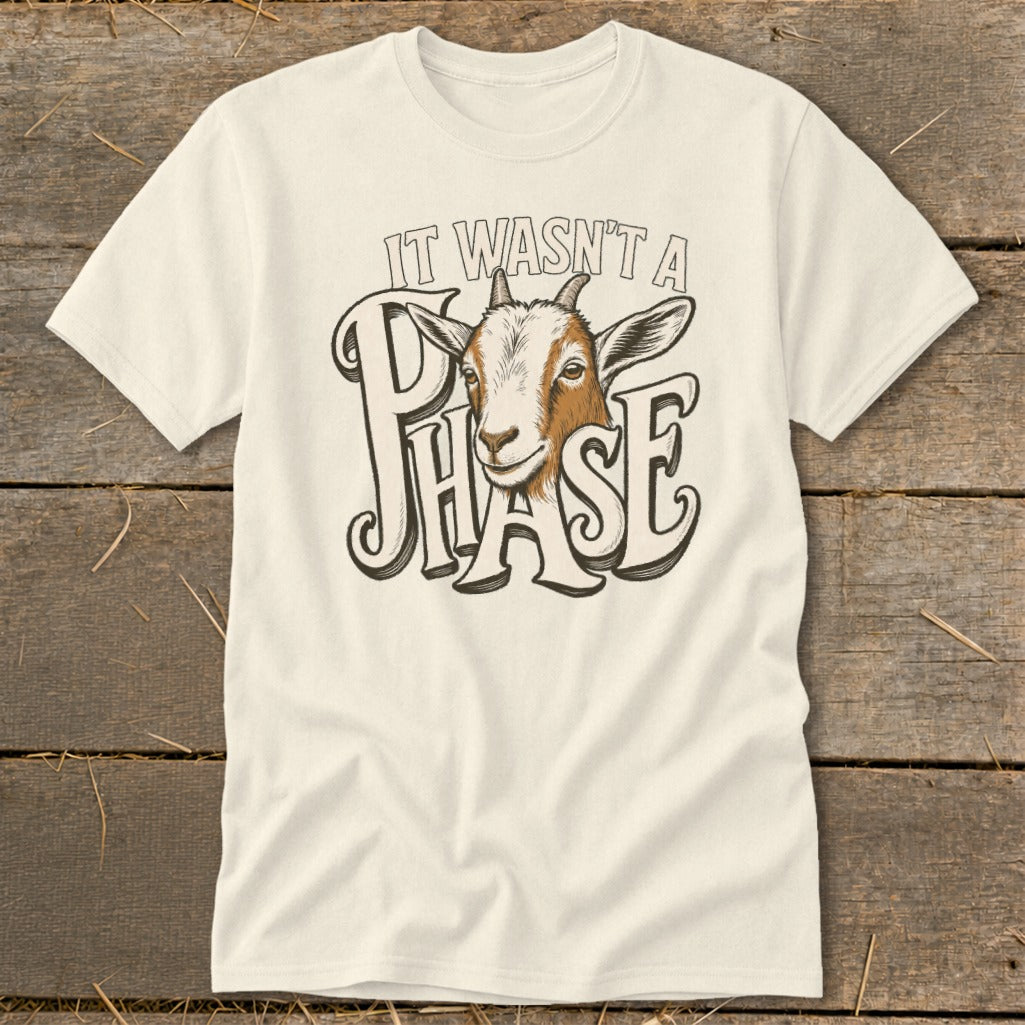 Cream t-shirt with a goat head and text "IT WASN'T A PHASE".