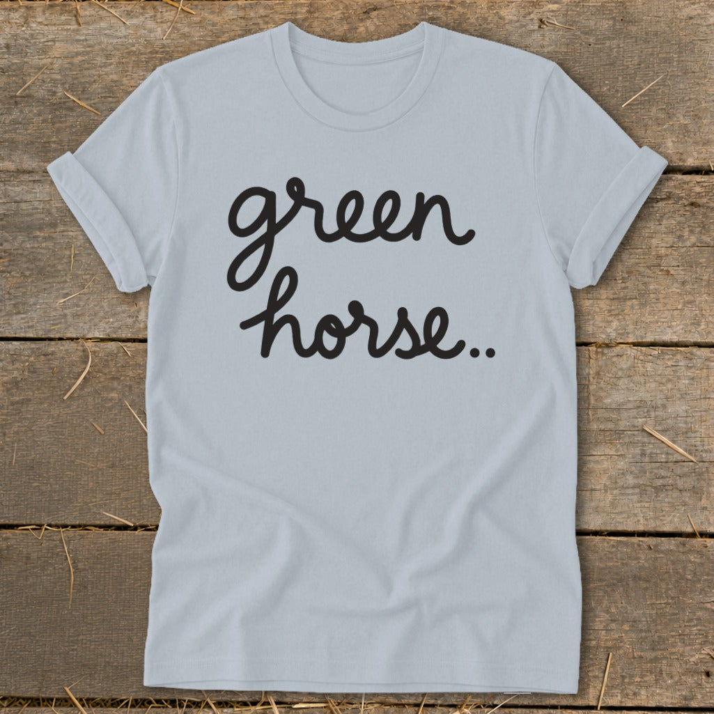Light blue t-shirt with black script text "green horse..".