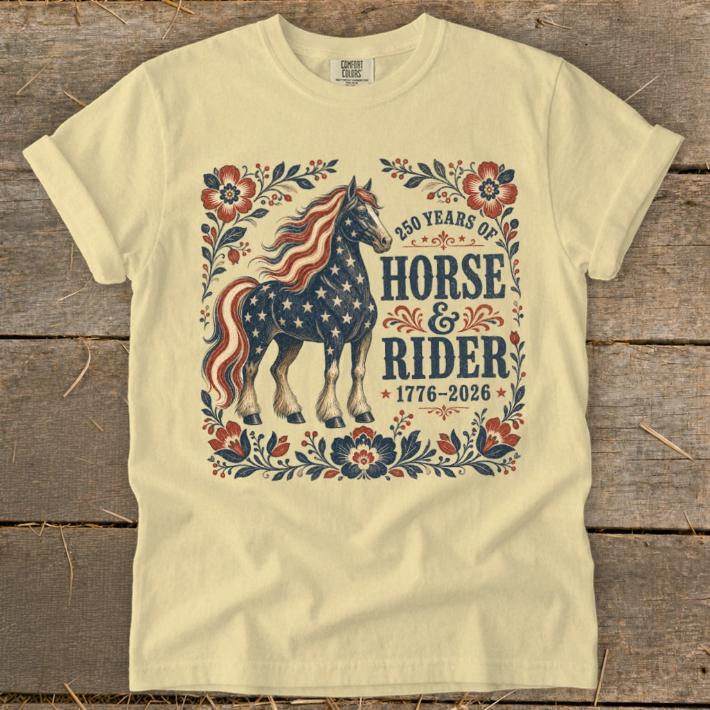 Cream t-shirt with patriotic horse graphic and "250 Years of Horse & Rider 1776-2026" text.