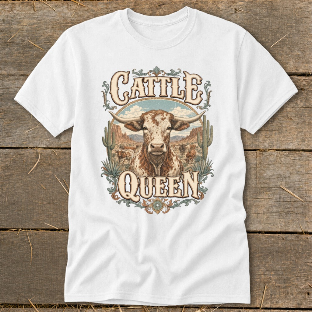 White t-shirt with "Cattle Queen" text and a longhorn bull in a desert landscape.