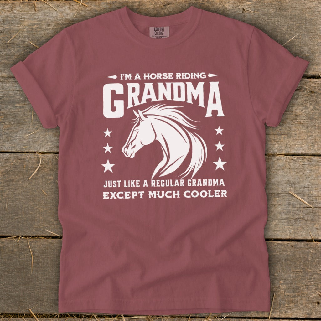 Maroon t-shirt with white text and horse graphic: "I'm a horse riding grandma except much cooler."