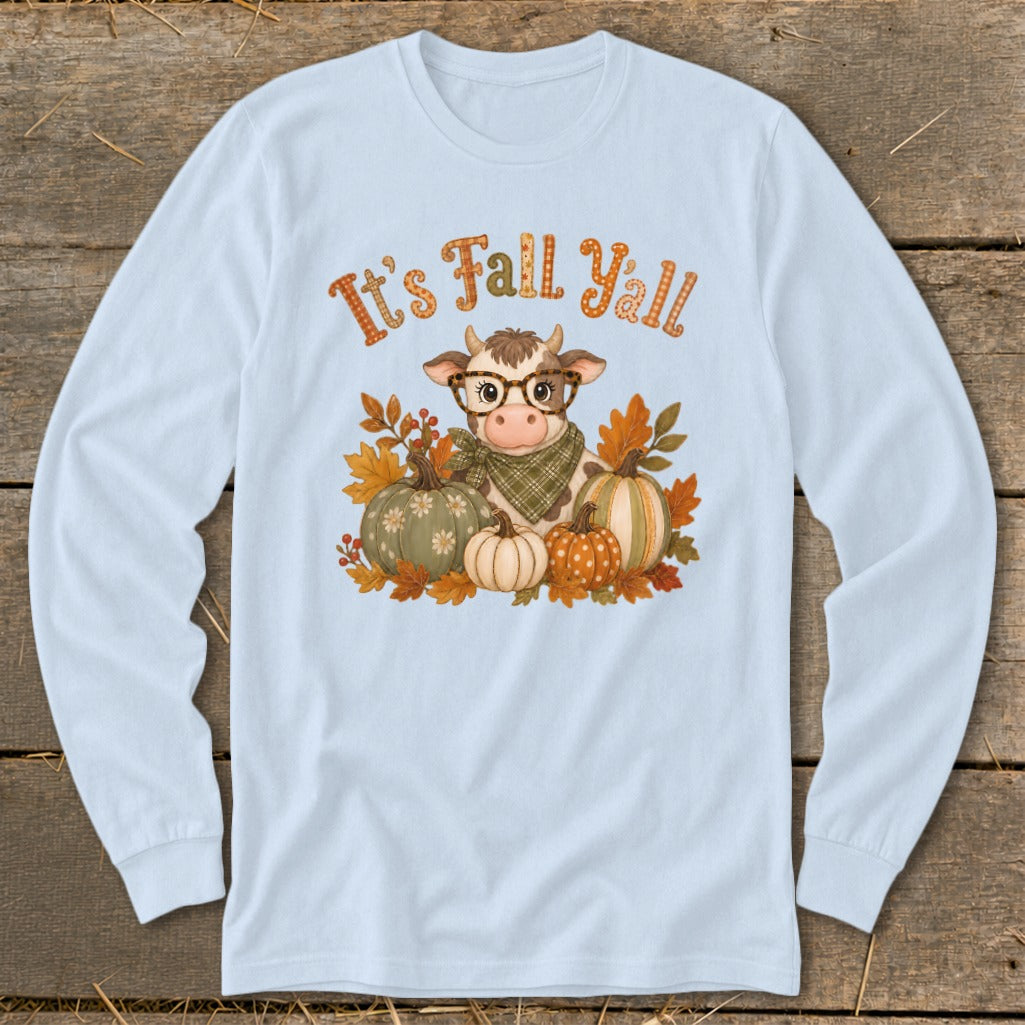Cow with glasses, scarf, and pumpkins with text "It's Fall Y'all".