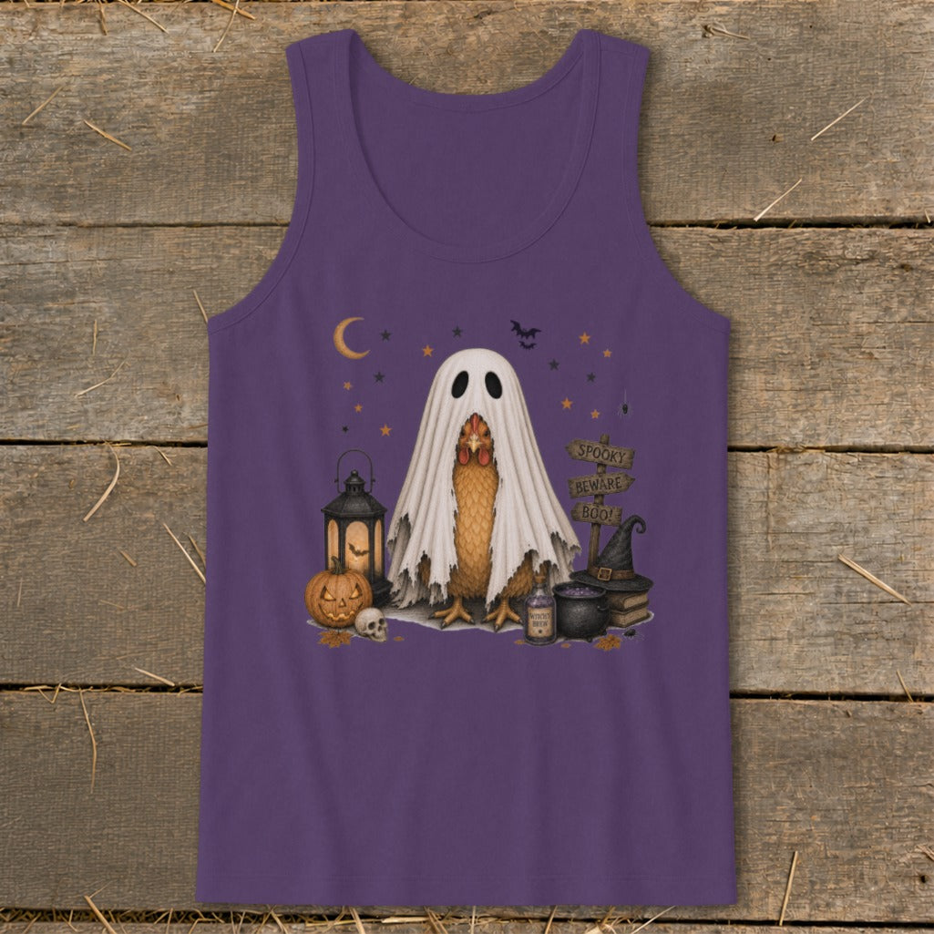 Chicken wearing a ghost costume with spooky Halloween decor.