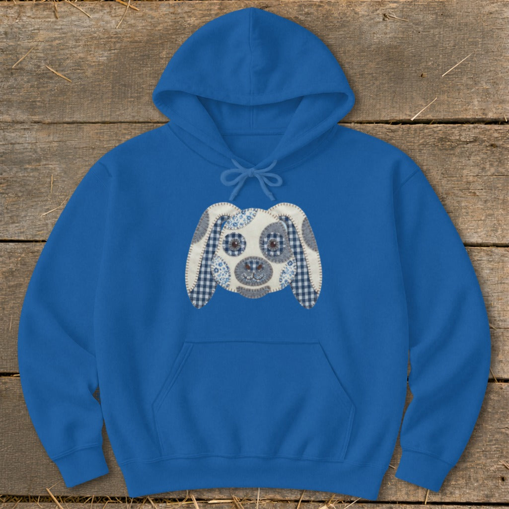 Blue hoodie with a patchwork dog face applique on the front.