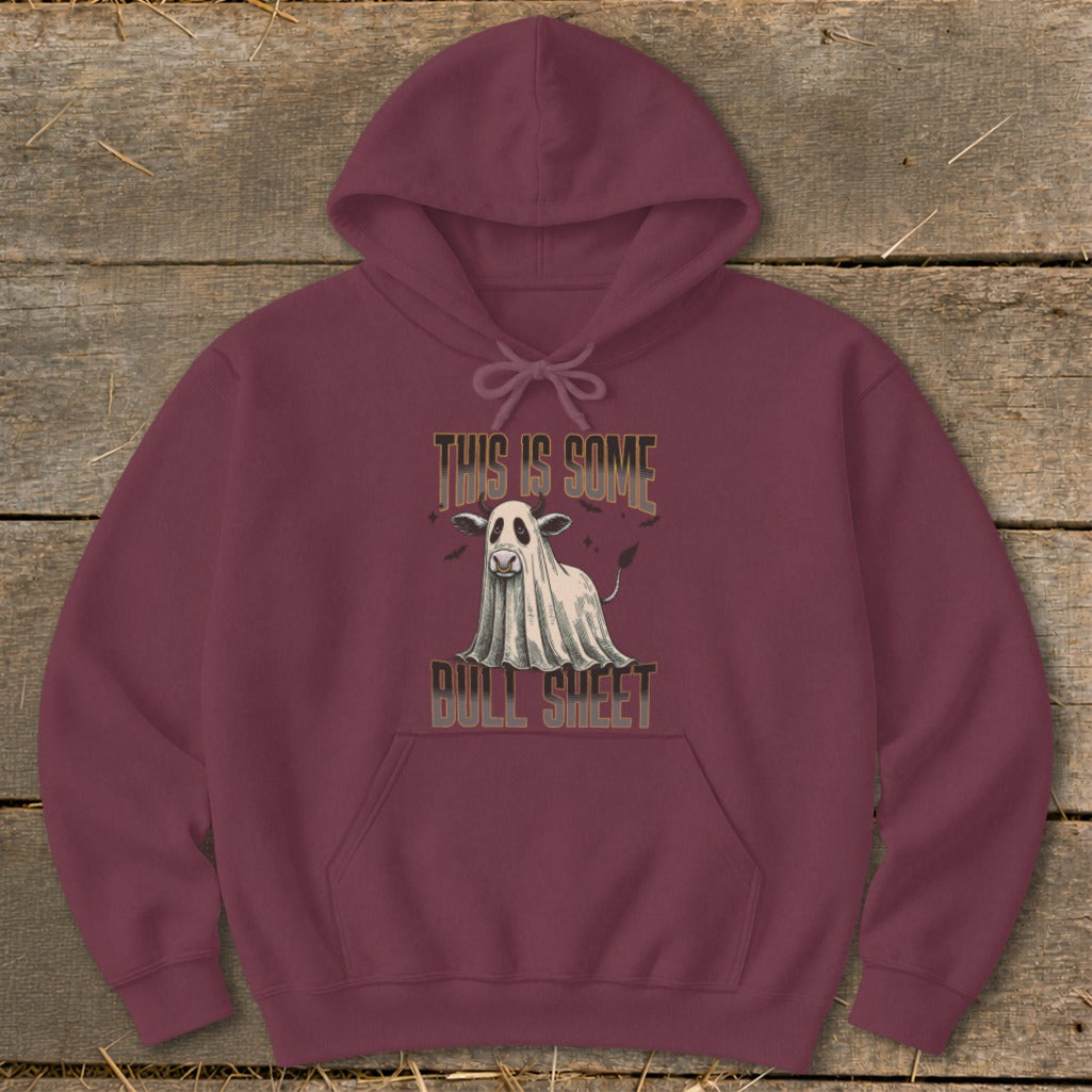Maroon hoodie with a cow dressed as a ghost graphic that reads "This Is Some Bull Sheet".