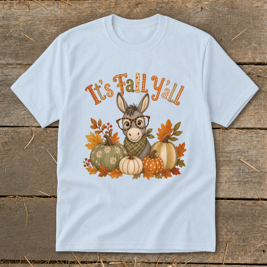 Donkey with glasses and pumpkins on a light blue t-shirt with "It's Fall Y'all" text.