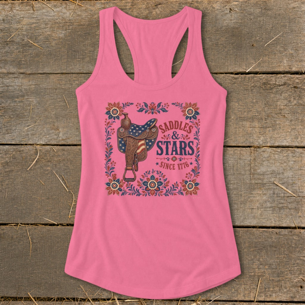 Pink tank top with western saddle and "Saddles & Stars Since 1776" text.