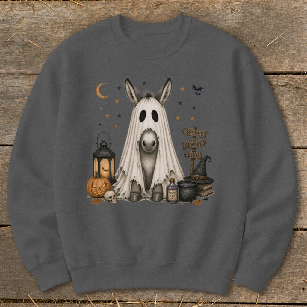 Donkey in a ghost costume with Halloween decorations and spooky signs.