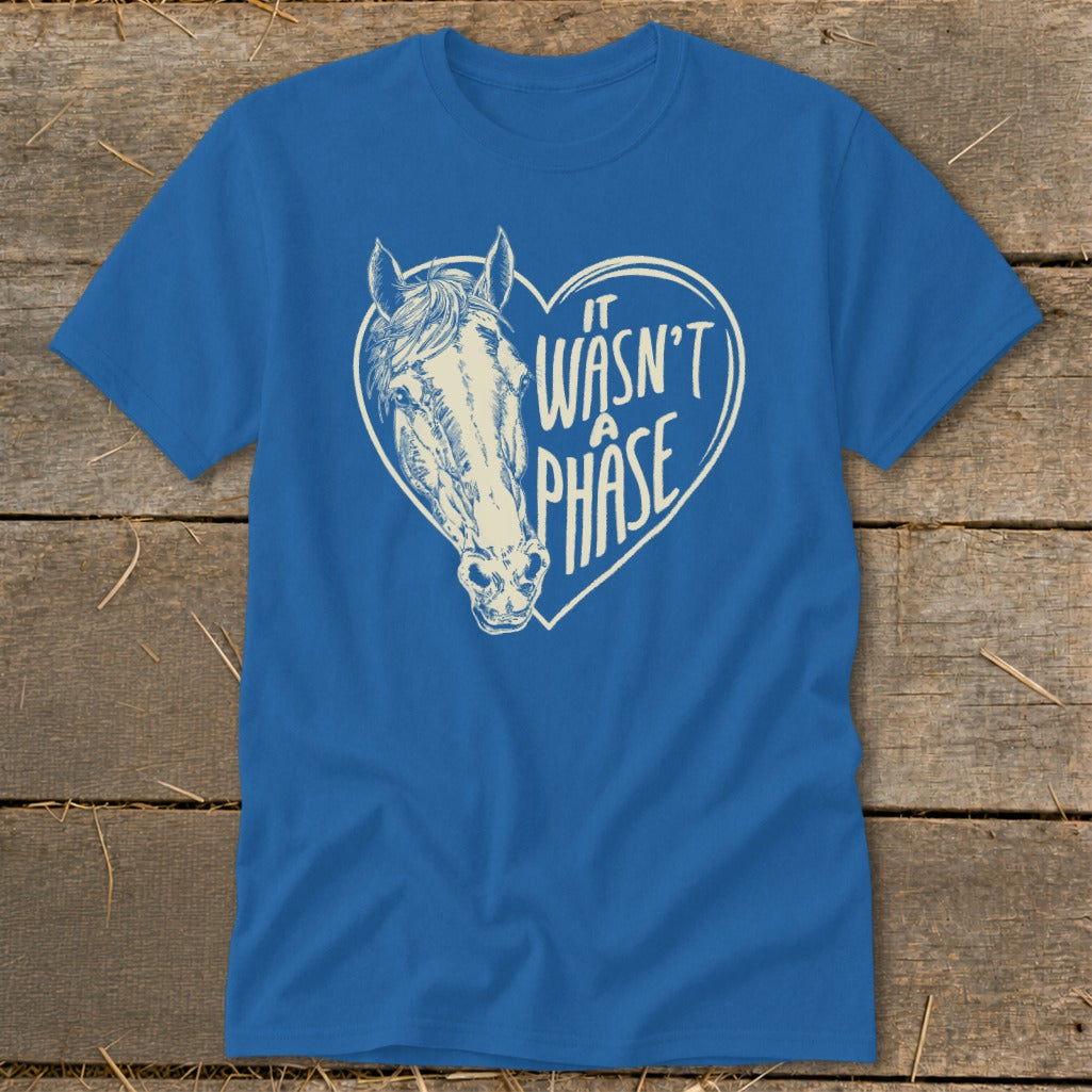 Blue t-shirt with horse head inside a heart graphic and text "It wasn't a phase".