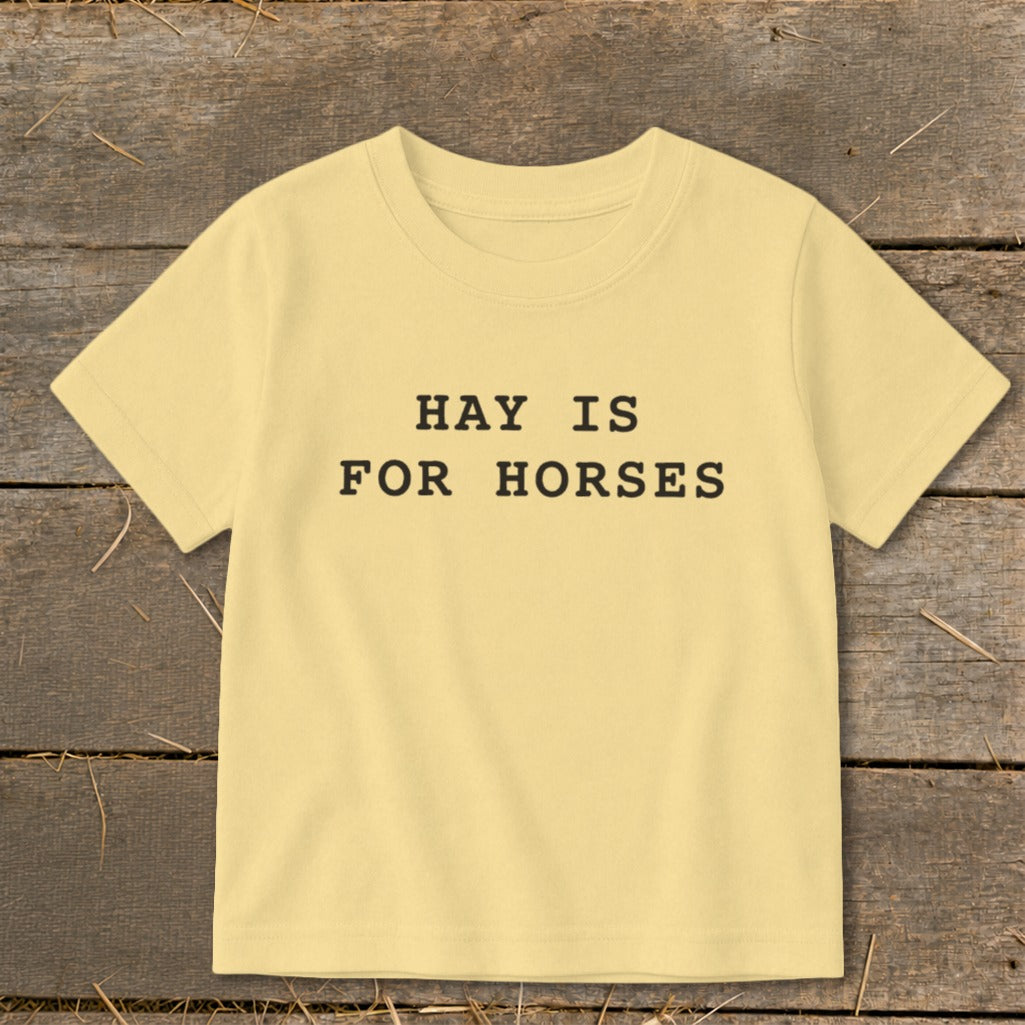 Light yellow t-shirt with "HAY IS FOR HORSES" text.