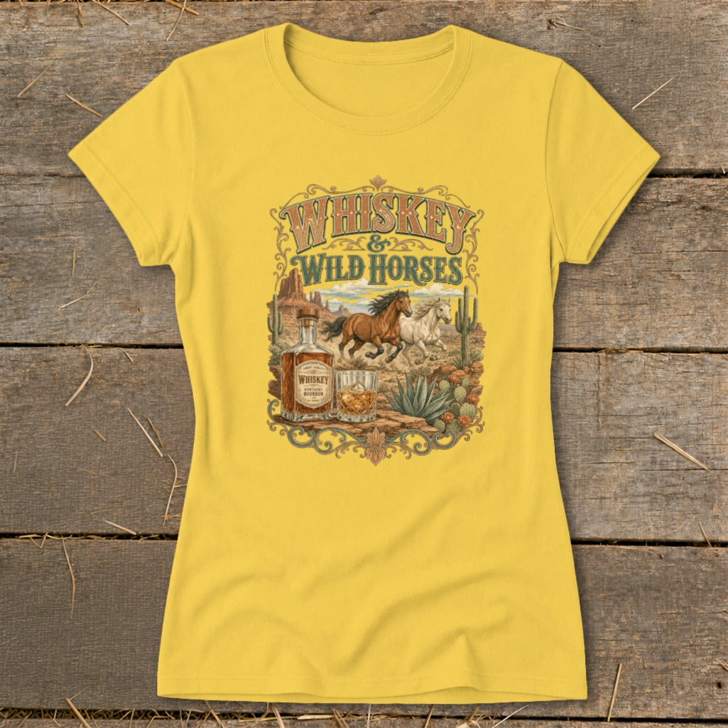 Yellow t-shirt with "Whiskey & Wild Horses" graphic, featuring horses, whiskey bottle, and desert scene.