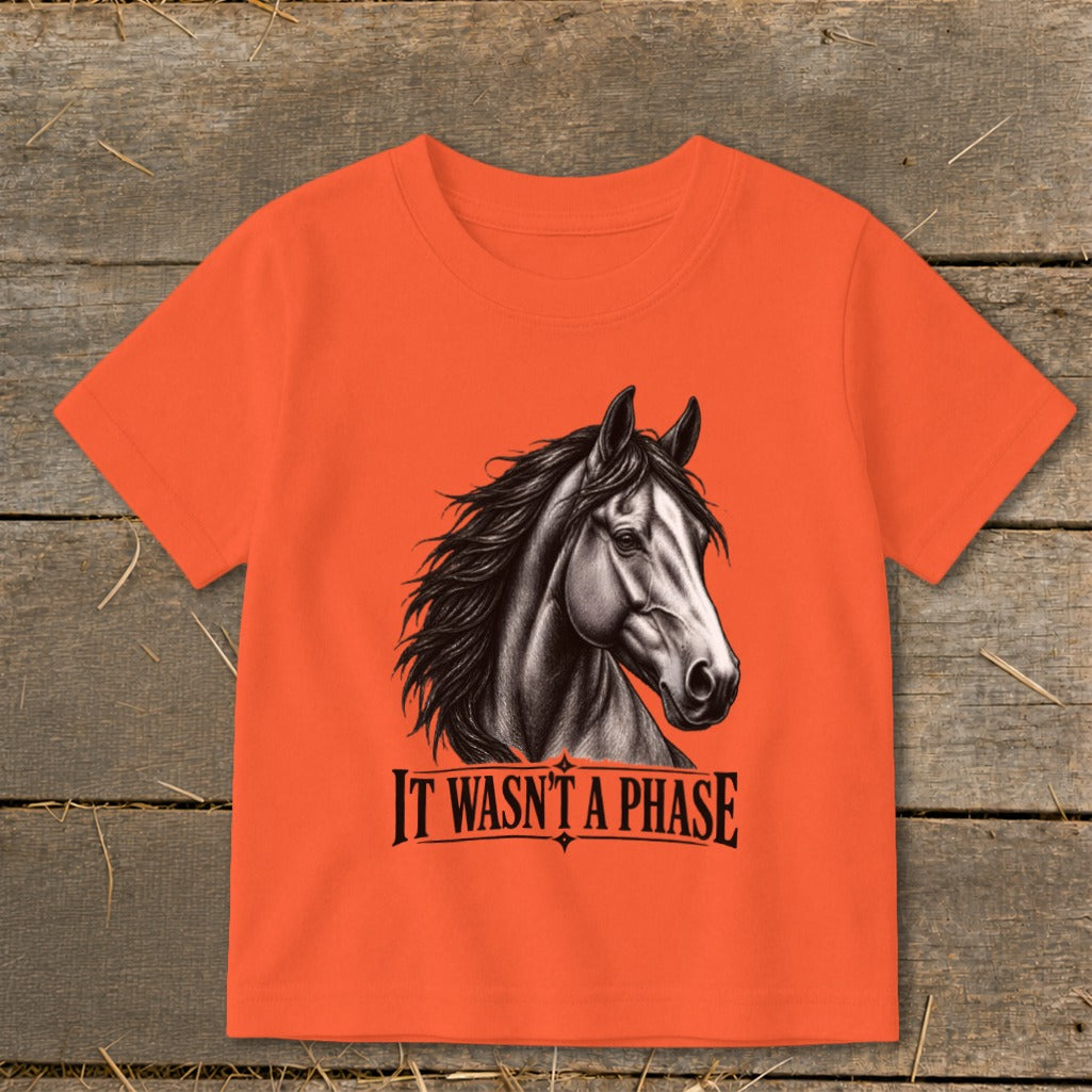 Orange t-shirt with a black and white horse head graphic and text.