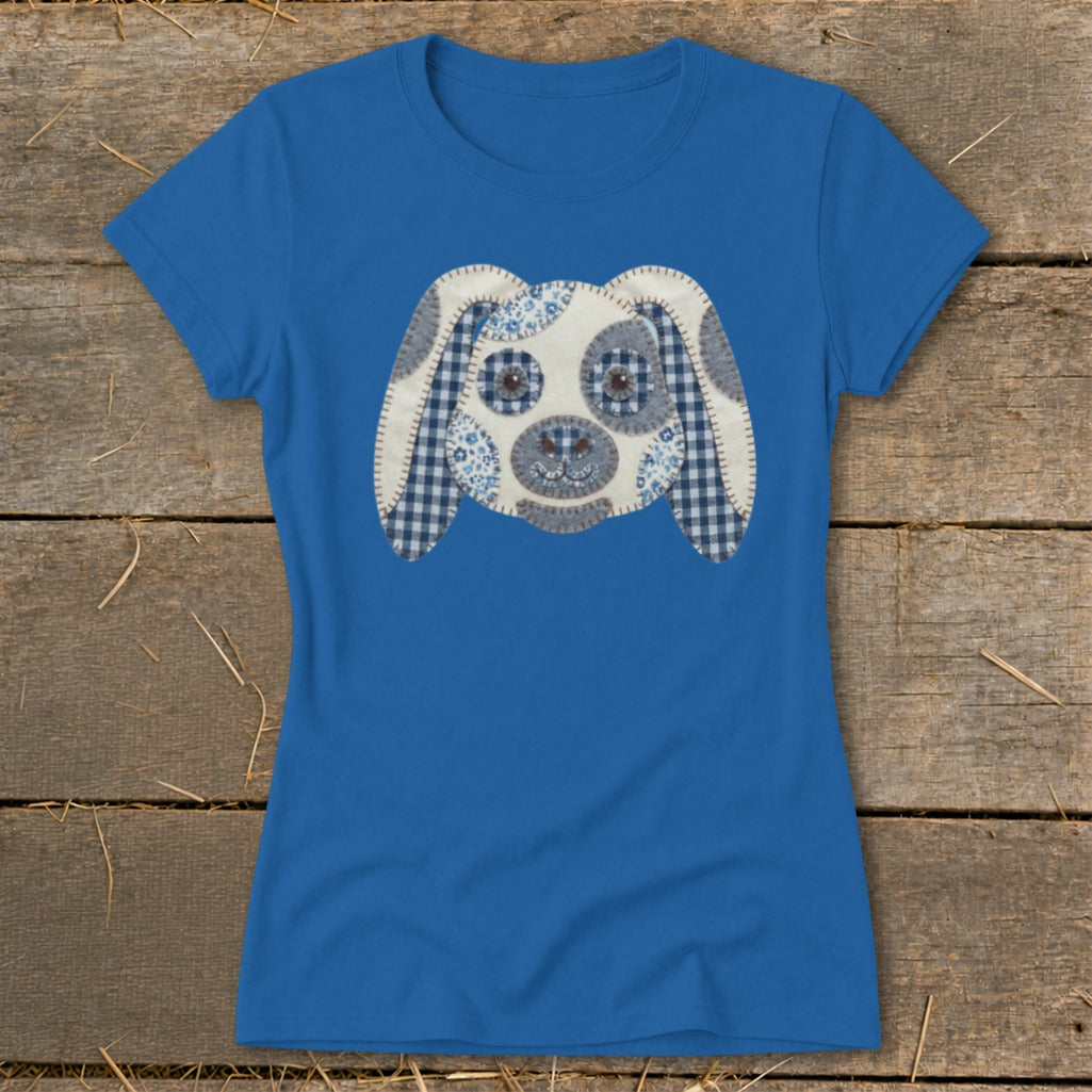 Blue t-shirt with a patchwork dog face graphic on the front.