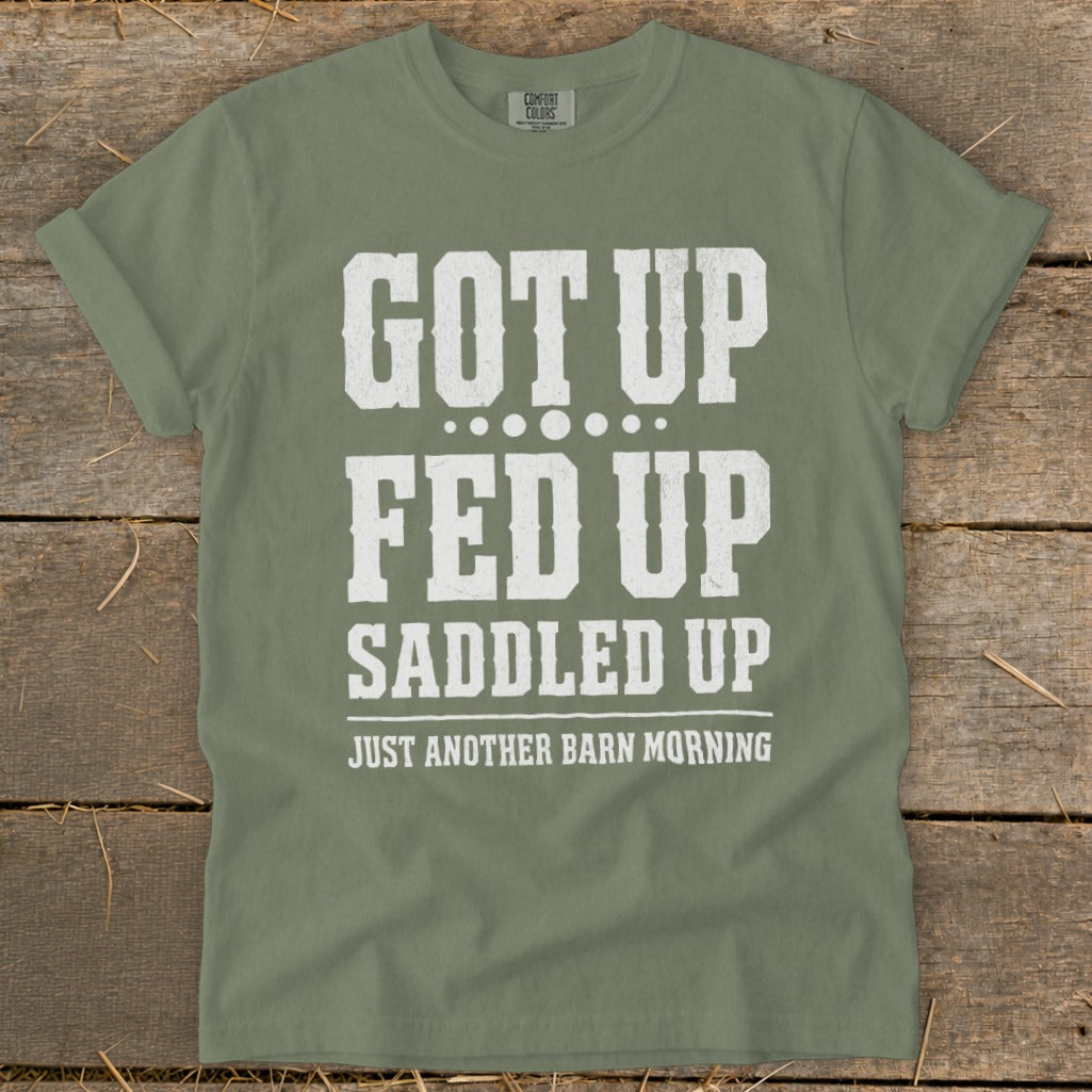 Green t-shirt with white text: "GOT UP FED UP SADDLED UP JUST ANOTHER BARN MORNING"
