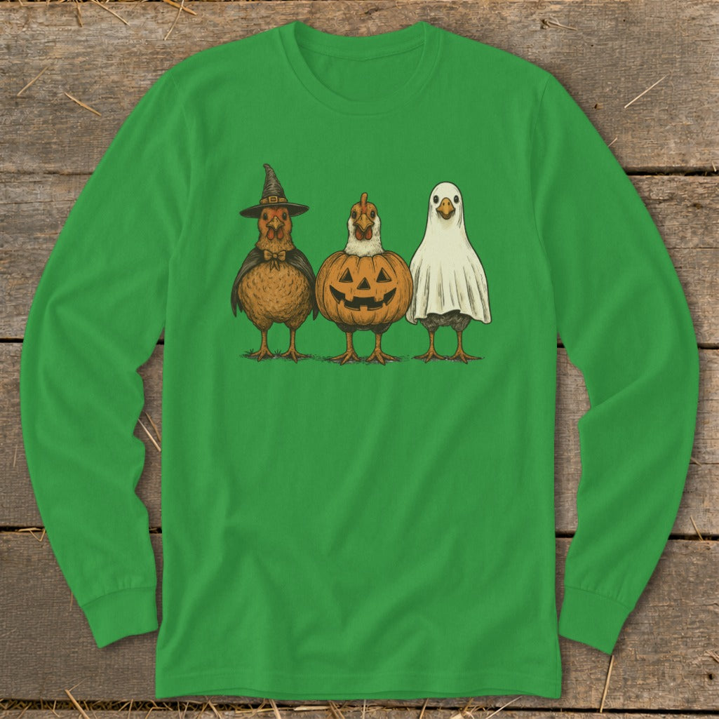 Three chickens dressed for Halloween: witch, pumpkin, and ghost costumes.