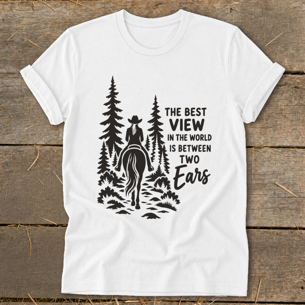 White t-shirt featuring a black graphic of a horseback rider in the forest with text.