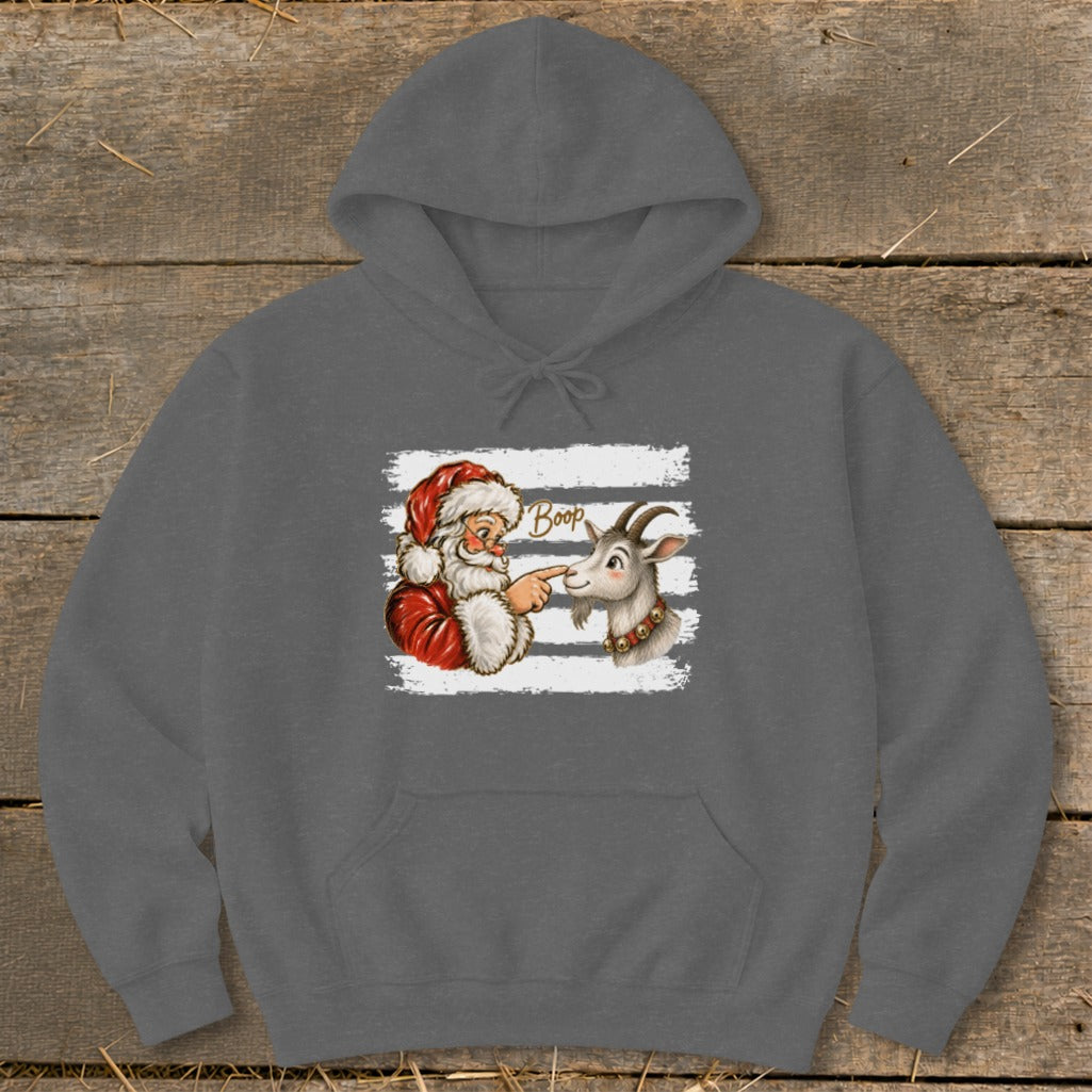 Santa booping a goat on the nose, with the word "Boop" above.