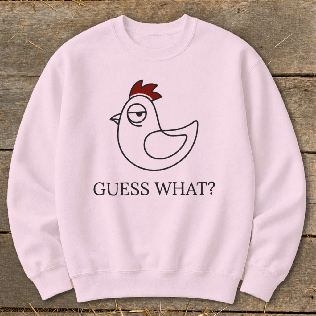 Pink sweatshirt with a line drawing of a chicken and "GUESS WHAT?" text.