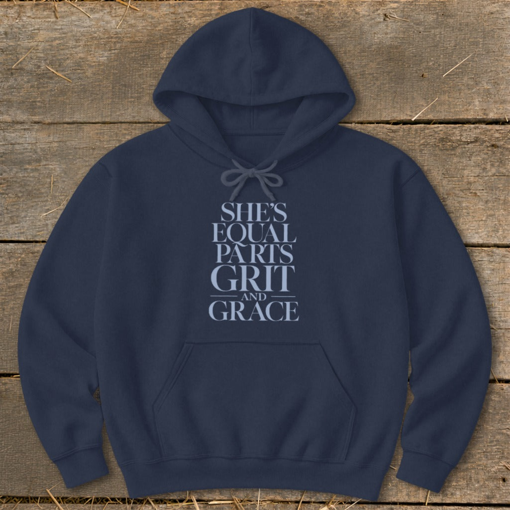 Navy hoodie with "She's Equal Parts Grit and Grace" text design.